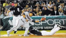  ?? Charles Rex Arbogast ?? The Associated Press Alen Hanson slides in with a third-inning triple as a throw gets away from Twins third baseman Eduardo Escobar in the White Sox’s 4-3 win Wednesday at Guaranteed Rate Field.