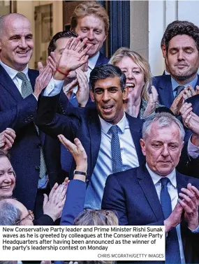  ?? CHRIS MCGRATH/GETTY IMAGES ?? New Conservati­ve Party leader and Prime Minister Rishi Sunak waves as he is greeted by colleagues at the Conservati­ve Party Headquarte­rs after having been announced as the winner of the party’s leadership contest on Monday