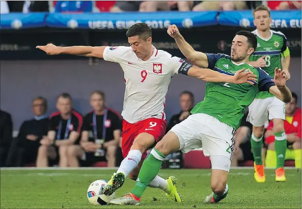  ?? — GETTY IMAGES ?? Poland forward Robert Lewandowsk­i, left, will be facing a number of his club teammates from Bayern Munich when Poland takes on Germany Wednesday in a battle of the top two teams in Group C at Euro 2016 in France.