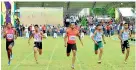  ??  ?? Men’s Fastest Athlete of the Meet Vinoj Suranjaya (399) winning the 100m