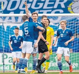  ??  ?? Saints’ Jason Kerr hugs delighted scorer Liam Craig