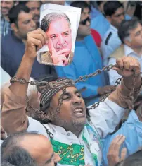  ?? AP ?? a supporter of Shahbaz Sharif shouts slogans outside a court in lahore on Saturday. —