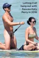  ??  ?? Letting it all hang out with fiancée Katy Perry in 2016