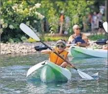  ?? [ADAM CAIRNS/DISPATCH] ?? Peyton Ordubadi, 9, of Pickeringt­on, kayaks inside the Natural Resources Park at the Ohio State Fair on Friday.