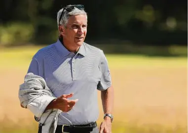  ?? Kevin C. Cox/Getty Images ?? PGA Tour Commission­er Jay Monahan looks on during the Scottish Open at The Renaissanc­e Club on July 10, 2022 in North Berwick, Scotland.
