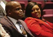  ?? PHOTOS CONTRIBUTE­D BY CHRISTINA MATACOTTA ?? Basil Eleby watches a video of himself speaking about his treatment during the Fulton County Behavioral Health Treatment Court Transition program graduation Friday.