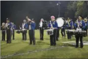  ?? JEN FORBUS — THE MORNING JOURNAL ?? Clearview 17-year-old seniors Isabel Valadez, from left, Elizabeth Gunter, Jared Sams and David Lebron, step forward to complete their final halftime performanc­e Oct. 27, on their home field in Lorain.