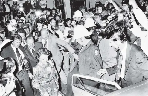  ?? PHOTO: OTAGO DAILY TIMES ?? Eggs splatter the crowd and a water bomb sprays the Prime Minister, the Rt Hon R.D. Muldoon, and Mrs Muldoon, as they leave the Dunedin Town Hall after a National Party election meeting in November 1978.