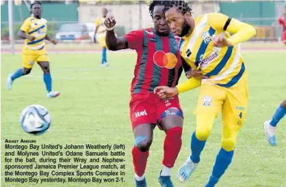  ?? ?? ASHLEY ANGUIN
Montego Bay United’s Johann Weatherly (left) and Molynes United’s Odane Samuels battle for the ball, during their Wray and Nephewspon­sored Jamaica Premier League match, at the Montego Bay Complex Sports Complex in Montego Bay yesterday. Montego Bay won 2-1.