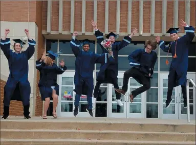  ?? SUBMITTED PHOTO ?? North Penn High School class of 2020studen­ts jump in celebratio­n at the high school entrance ahead of their formal graduation Thursday.