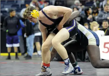  ?? BEA AHBECK/NEWS-SENTINEL ?? Tokay's Mathew Cooper wrestles in his 195 pound match against Elk Grove's John Gblah during their 5th/6th place championsh­ip match at the Stockton Arena on Saturday.