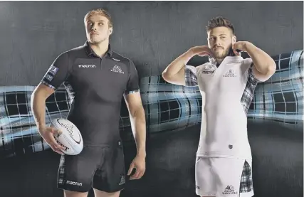  ??  ?? Jonny Gray, left, and Ali Price model Glasgow Warriors’ new playing kit, which was launched yesterday.