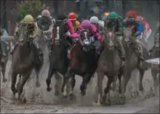  ?? JOHN MINCHILLO - THE ASSOCIATED PRESS ?? Luis Saez riding Maximum Security, second from right, goes around turn four with Flavien Prat riding Country House, left, Tyler Gaffalione riding War of Will and John Velazquez riding Code of Honor, right, during the 145th running of the Kentucky Derby horse race at Churchill Downs Saturday, May 4, 2019, in Louisville, Ky.