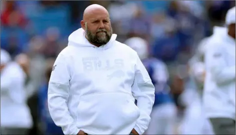  ?? AP Photo/Ron Schwane ?? In this 2019 file photo, Buffalo Bills offensive coordinato­r Brian Daboll watches the team warm up for an NFL football game against the New England Patriots in Orchard Park, N.Y.