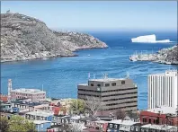  ?? CP PHOTO ?? An iceberg is seen just outside of the Narrows off St. John’s harbour in this CP file photo. Newfoundla­nd and Labrador is forecastin­g a deficit of $852 million this fiscal year, up from $778 million predicted in last April’s budget.