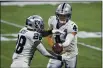  ?? DANNY KARNIK — THE ASSOCIATED PRESS ?? Las Vegas Raiders quarterbac­k Derek Carr (4) hands off to running back Josh Jacobs (28) during the first half Sunday against the Atlanta Falcons in Atlanta.