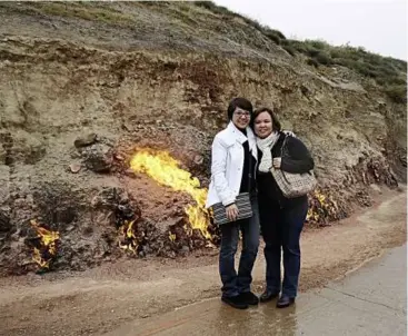  ??  ?? Parlo Tours’ sales director Annie Ng and operations director Carol Sum in Yanar Dag – Burning Mountain.