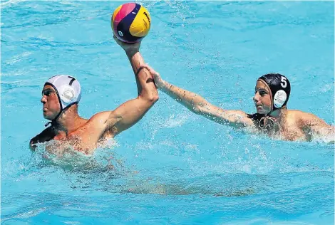  ??  ?? IN CONTROL: Matthew Hillary of St Andrew’s, left, is challenged by an opponent during the Vides water polo tournament in East London at the weekend. Hillary scored 25 goals and was named the player of the tournament