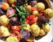  ??  ?? Food activist Anita Stewart concocted this colourful potato salad with potatoes from the University of Guelph’s Elora Research Station and dressed it with a basil vinaigrett­e.