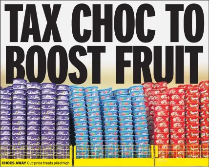  ??  ?? CHOCS AWAY Cut-price treats piled high