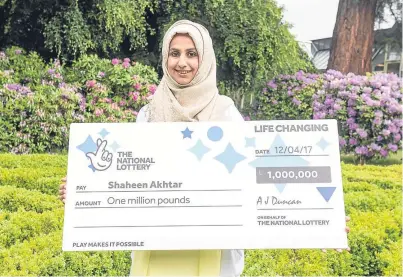  ?? Picture: Michal Wachucik. ?? Shaheen Akhtar with her cheque for £1 million.