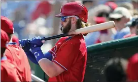  ?? CARLOS OSORIO — THE ASSOCIATED PRESS ?? The Phillies’ Bryce Harper prepares to bat during a spring training game last month in Clearwater, Fla.