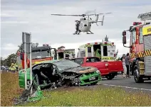 ?? PHOTO: WARWICK SMITH/FAIRFAX NZ ?? A man had to be cut from his car after the three-car smash.