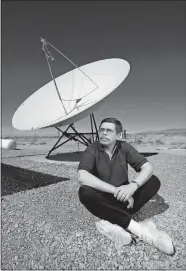  ?? AARON MAYES/LAS VEGAS SUN VIA AP ?? This March 7, 1997, photo shows late night radio talk show host Art Bell near a satellite dish at his Pahrump, Nev., home.
