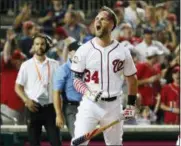  ?? ALEX BRANDON — THE ASSOCIATED PRESS ?? Bryce Harper celebrates his winning hit during the Home Run Derby on July 16 in Washington, D.C.