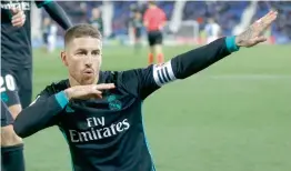  ?? AP ?? Real Madrid’s Sergio Ramos celebrates his goal against Leganes in a Spanish League match at the Butarque Stadium in Leganes on Wednesday. Real won 3- 1. —