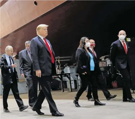  ?? PHOTO: CARLOS BARRIA ?? Investment: President Donald Trump tours Fincantier­i Marinette Marine in Wisconsin.