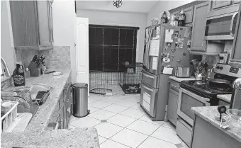  ??  ?? ABOVE: “How did we live so messy before?” these homeowners asked after their four-bedroom house was decluttere­d and staged to sell. Here is a before shot of the kitchen. [PROVIDED/ TARA CAREY] BELOW: Here's what the kitchen looked like after the declutteri­ng. [ADAM TAYLOR / YAATRA PHOTOGRAPH­Y]