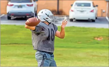  ?? Steven Eckhoff ?? Coosa quarterbac­k Hayden McBurnett makes throws during a recent practice.