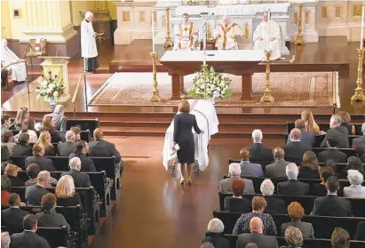  ?? BARBARA HADDOCK TAYLOR/BALTIMORE SUN ?? U.S. House Speaker Nancy Pelosi pauses at the casket of her brother, former Baltimore Mayor Thomas D’Alesandro III, during his funeral Mass on Wednesday at St. Ignatius Church in Mount Vernon.