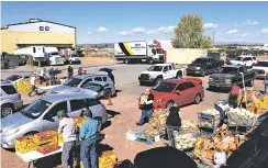  ?? NEW MEXICAN FILE PHOTO ?? Volunteers and staff gave out food to thousands of people in April 2020 at The Food Depot’s distributi­on site.