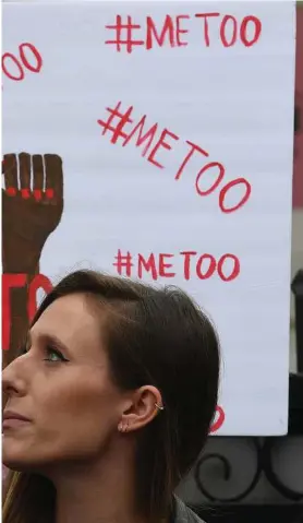  ?? Mark Ralston / AFP / Getty Images ?? supporters protest during a #MeToo march in Los Angeles on Nov. s companies that investigat­e claims of sexual harassment and offer ropriate behavior.