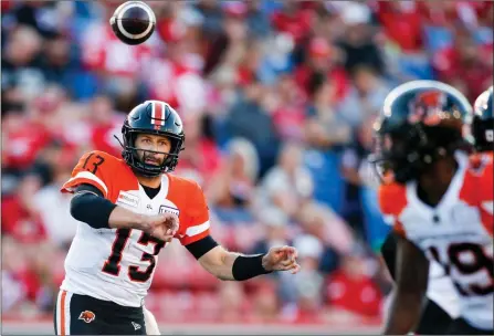  ?? The Canadian Press ?? BC Lions’ quarterbac­k Mike Reilly throws the ball during first-half CFL action against the Stampeders in Calgary, Thursday.