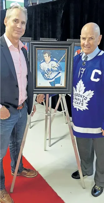  ?? SUBMITTED PHOTO ?? Artist Tony Harris and Toronto Maple Leafs great Dave Keon display the portrait Harris created of the former Leafs star as part of the top 100 NHL players exhibit the NHL commission­ed Harris to do. The exhibit debuted Saturday in Montreal on the 100th...