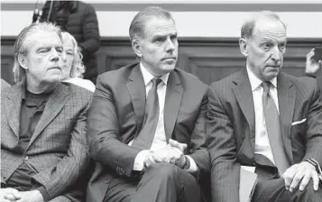  ?? JOSE LUIS MAGANA AP ?? Hunter Biden, President Joe Biden’s son (center), and his attorney Abbe Lowell (right), attend a House Oversight Committee hearing Wednesday. Biden on Thursday pleaded not guilty in a federal tax case.