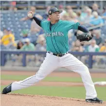  ?? JENNIFER STEWART/GETTY IMAGES ?? Felix Hernandez gets the ball for the Seattle Mariners in today’s season opener against the Astros. Hernandez is coming off a disappoint­ing season in which he finished 11-8 with a 3.82 ERA.
