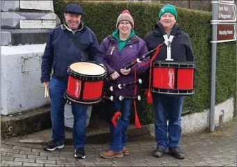  ??  ?? Mark O’Sullivan, Alison Fitzpatric­k and Donie Forde of Newmarket Pipe Band at the monument on St Patrick’s day.