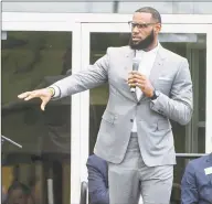  ?? Phil Long / Associated Press ?? LeBron James speaks at the opening ceremony for the I Promise School in Akron, Ohio, in July 2018. The I Promise School is supported by the The LeBron James Family Foundation and is run by Akron Public Schools.
