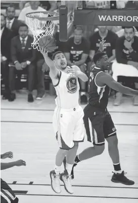  ?? JOSE CARLOS FAJARDO/STAFF ?? The Warriors’ Klay Thompson, who had 14 points, scores against the Utah Jazz in Game 2 of the teams’ second-round playoff series Thursday night.