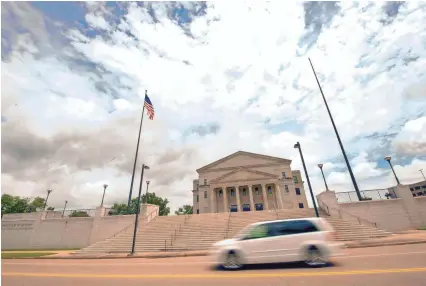  ?? BARBARA GAUNTT/CLARION LEDGER ?? The pole that once flew the Mississipp­i state flag in front of the Carroll Gartin Justice Building in Jackson, Miss., stands empty Monday after the state legislatur­e passed a bill to change the flag Sunday.