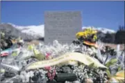  ?? CHRISTOPHE ENA / ASSOCIATED PRESS ?? A stele and flowers laid in memory of the victims are placed in the area where the Germanwing­s jetliner crashed in the French Alps, in Le Vernet, France, on Friday.