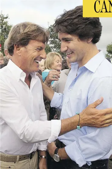  ?? . THE CANADIAN PRESS/FILES ?? Justin Trudeau, right, chats with Stephen Bronfman, at the time the Liberal party’s chief fundraiser, in St. Peters Bay, P.E.I., in August 2013.