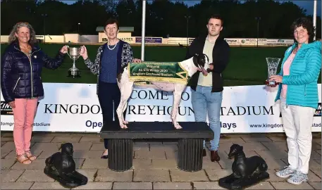  ?? Photo by www.deniswalsh­photograph­y.com ?? Winning joint-owner Karen Geoghegan accepts the winner’s perpetual trophy from Angela Dowling with handler Jack O’Connell and Jane Dowling after Razldazl Monarch won the John & Mary Killeacle Dowling Memorial Sweepstake Final at the Kingdom Greyhound Stadium on Friday night.