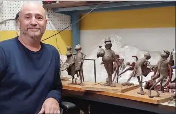  ?? SUBMITTED PHOTO ?? Calvin Stinger of Beebe poses with some of his clay “idea pieces” for the Tiny Toads Initiative in downtown Conway. Stinger was chosen to create bronze toad sculptures for 10 historic buildings or locations. A pamphlet that will tell the history of each place will accompany the Tiny Toads Tour.