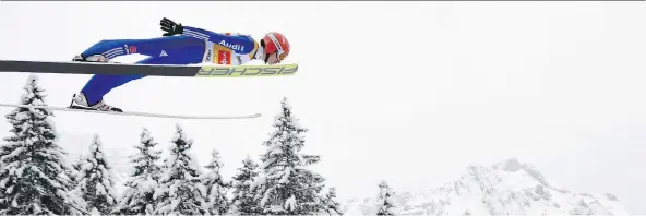  ?? GIAN EHRENZELLE­R/KEYSTONE VIA THE ASSOCIATED PRESS ?? The thought of soaring like a ski jumper can be terrifying for Canadian Olympians content to stick to their own sport.