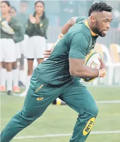  ??  ?? Siya Kolisi enters the field during a rugby match between South Africa and England at Ellis Park in Johannesbu­rg in this June 9 file photo. — AFP photo